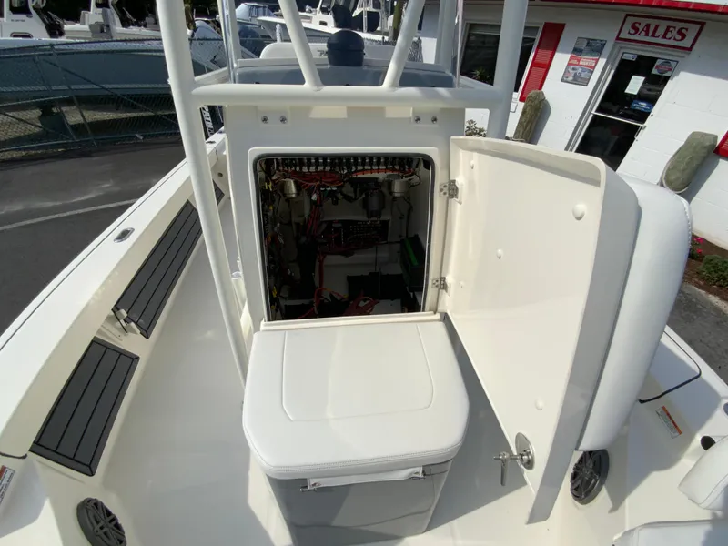 Slide: The Image of 2024 Pathfinder 2200 TRS boat interior with open storage compartment. - 22