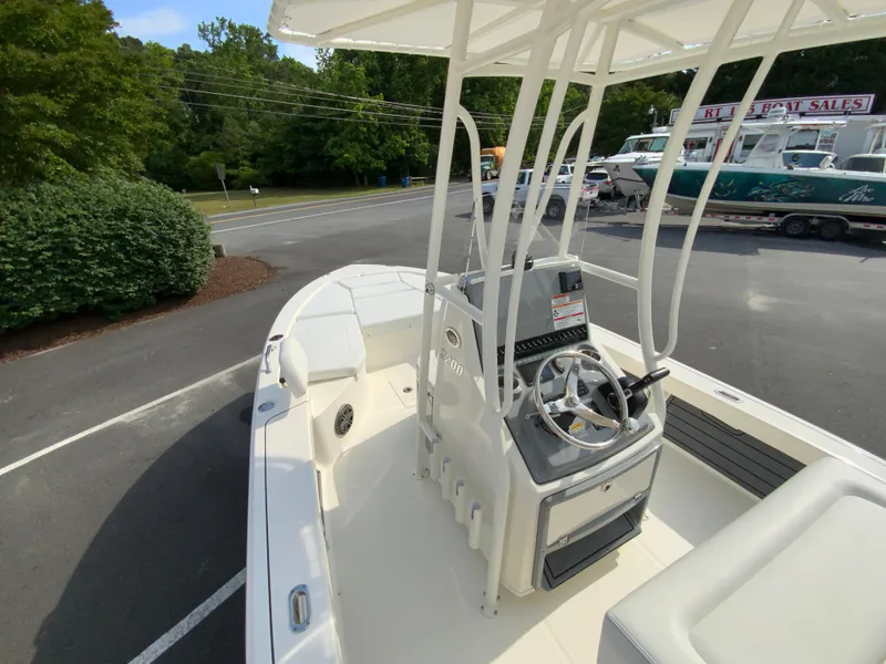 Slide: The Image of 2024 Pathfinder 2200 TRS boat interior at dealership. - 25