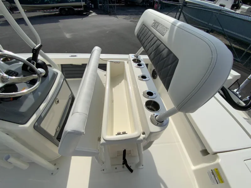 Slide: The Image of 2024 Pathfinder 2200 TRS boat interior with helm station and seating. - 28