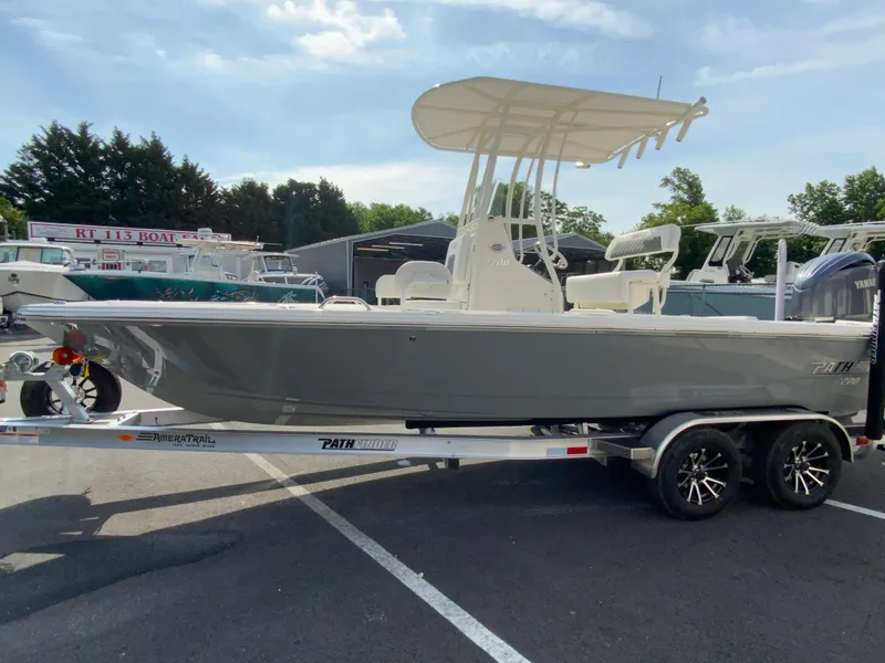 Slide: The Image of 2024 Pathfinder 2200 TRS boat on trailer in parking lot. - 6