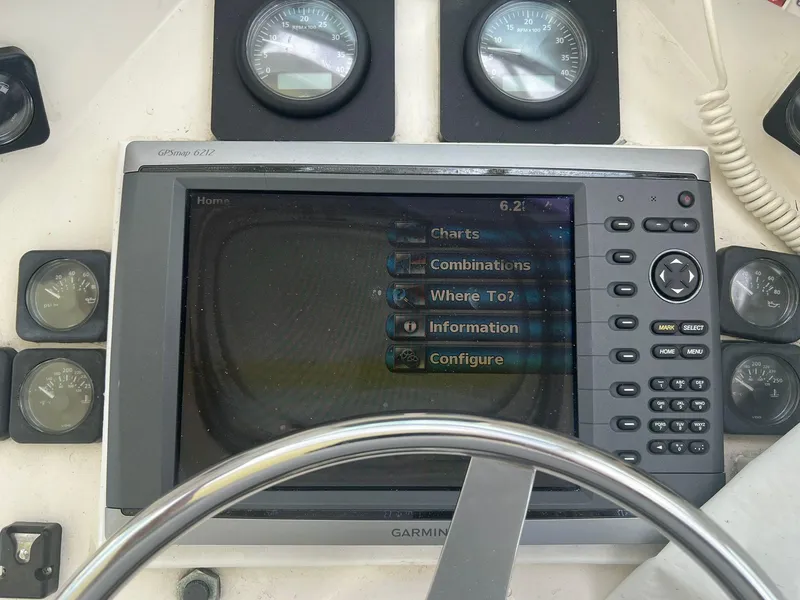 Slide: The Image of Boat navigation system with Garmin display and gauges on a 2001 Topaz Express. - 17