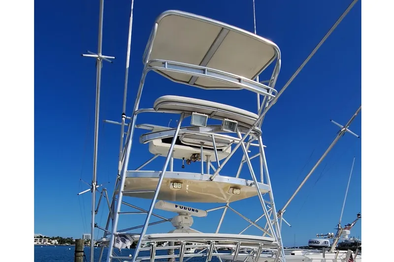 Slide: The Image of Tower of a 2001 Topaz Express boat against a clear blue sky. - 19