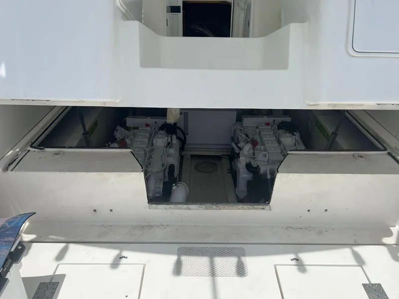 Slide: The Image of Engine compartment of a 2001 Topaz Express boat, showcasing dual engines. - 25