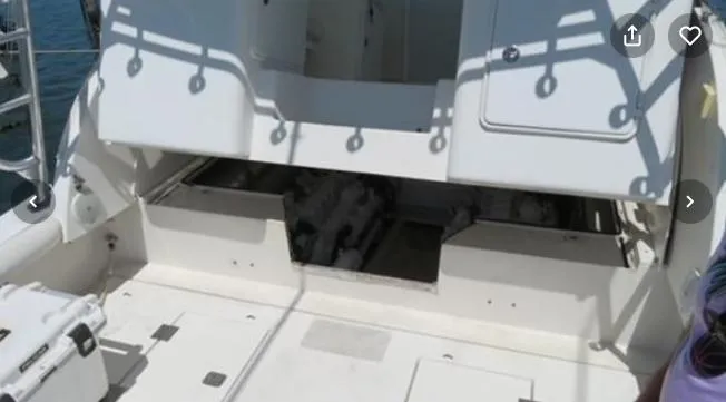 Slide: The Image of 2001 Topaz Express boat engine compartment with open hatch, showing interior details. - 26