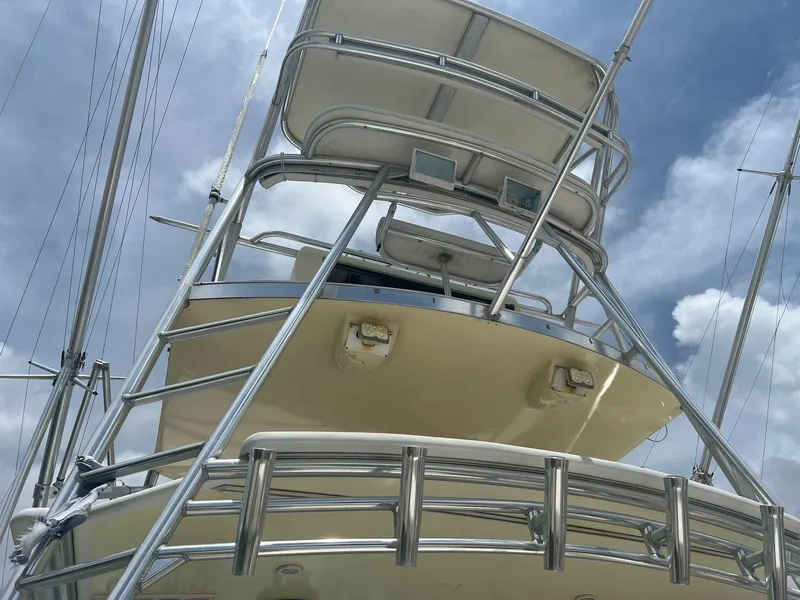 Slide: The Image of Towering view of a 2001 Topaz Express boat against a cloudy sky. - 4