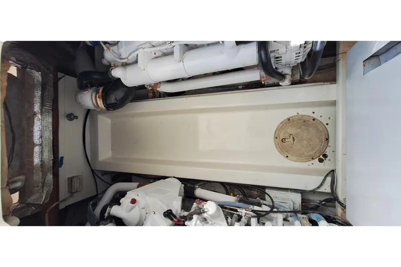 Slide: The Image of Engine room of a 2001 Topaz Express boat, showcasing mechanical components. - 45