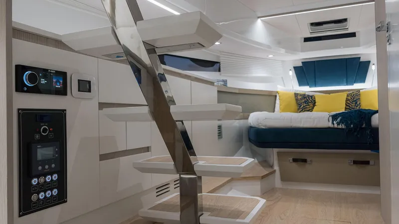 Slide: The Image of Interior of 2025 Fiart 35 Seawalker yacht with modern staircase and cozy sleeping area. - 10