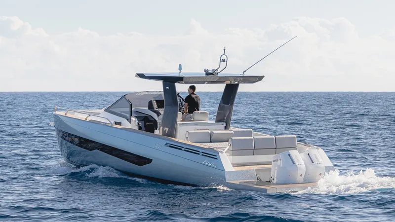 Slide: The Image of 2025 Fiart 35 Seawalker luxury motorboat cruising on open water. - 3