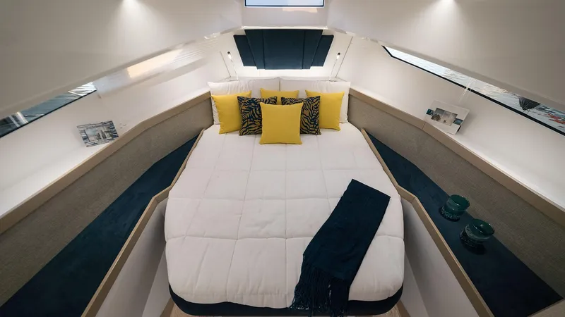 Slide: The Image of Luxurious cabin interior of the 2025 Fiart 35 Seawalker yacht with cozy bedding. - 7