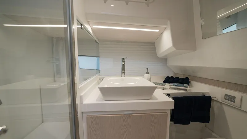 Slide: The Image of Modern bathroom in the 2025 Fiart 35 Seawalker yacht with sleek fixtures and ample lighting. - 9