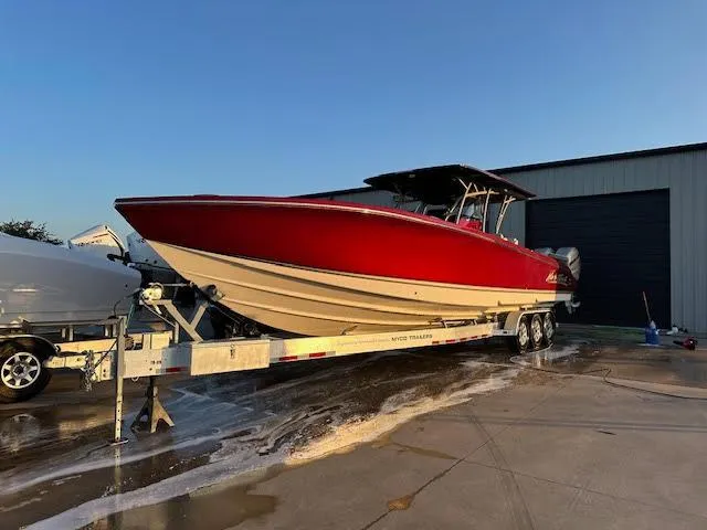 The Image of 2020 Nor-Tech 390 Sport Center Console boat on a trailer. - 0