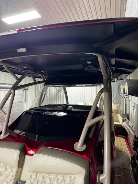 Slide: The Image of 2020 Nor-Tech 390 Sport Center Console boat interior with T-top and seating. - 10