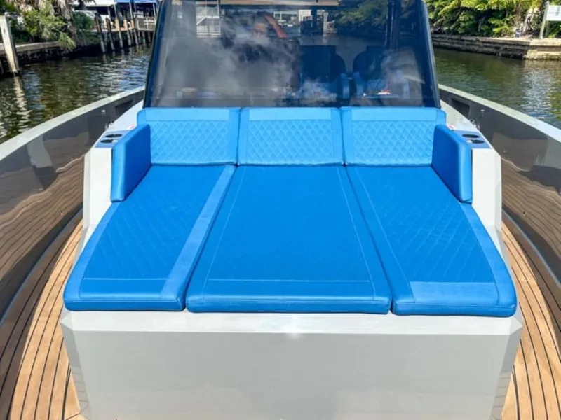 Slide: The Image of 2023 De Antonio Yachts D42 Open with blue sunbed on deck. - 11