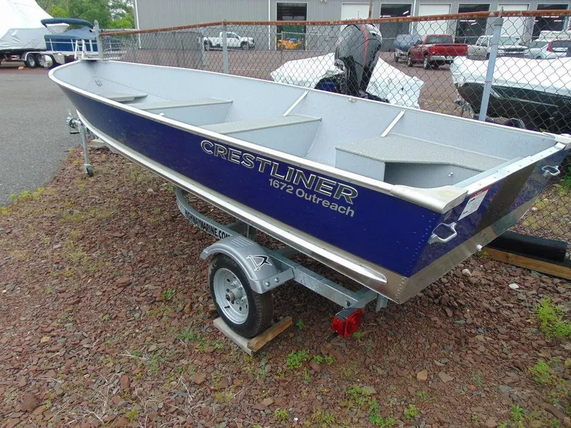 Slide: The Image of 2024 Crestliner 1672 Outreach boat on trailer in outdoor lot. - 3