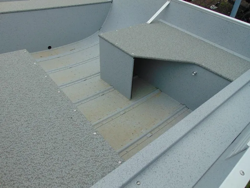 Slide: The Image of 2024 Crestliner 1672 Outreach boat interior with non-slip flooring and seating. - 5