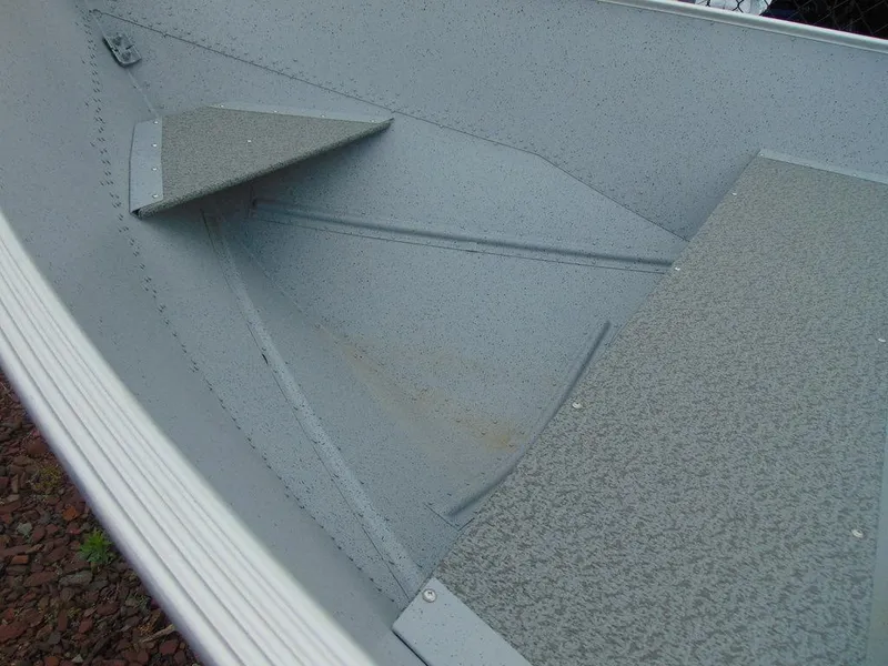 Slide: The Image of 2024 Crestliner 1672 Outreach boat interior, showing durable seating and non-slip flooring. - 6