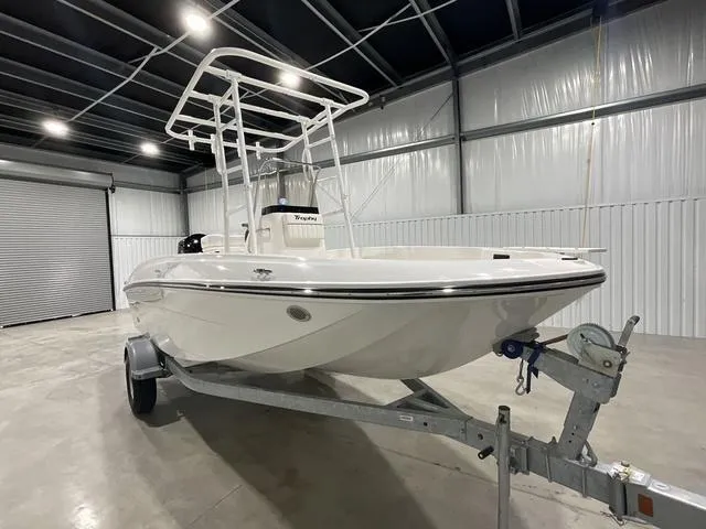Slide: The Image of 2024 Bayliner T18BAY boat on trailer in indoor storage facility. - 6