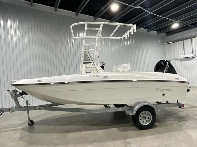 Slide: The Image of 2024 Bayliner T18BAY boat on trailer in indoor storage. - 7