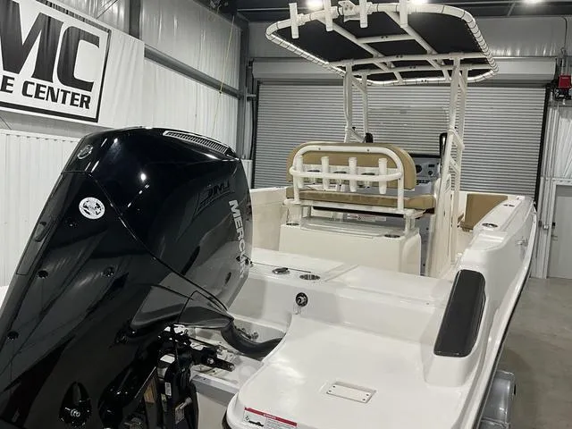 Slide: The Image of 2024 Bayliner T22CC boat with Mercury engine in a showroom. - 19