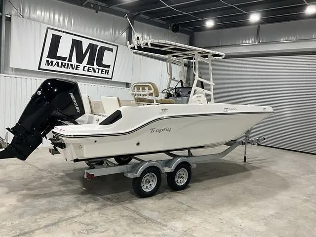 Slide: The Image of 2024 Bayliner T22CC boat on trailer at LMC Marine Center showroom. - 4