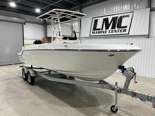 Slide: The Image of 2024 Bayliner T22CC boat on trailer at LMC Marine Center showroom. - 6