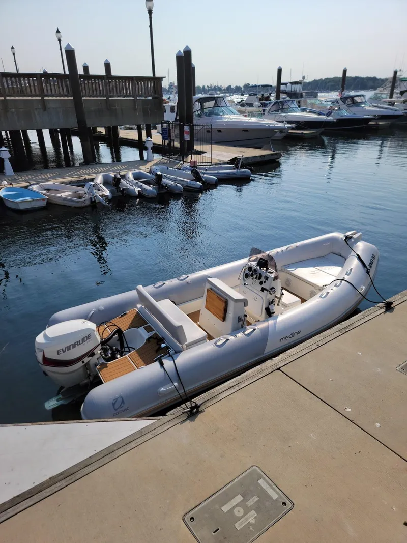 Slide: The Image of 2014 Zodiac Medline 580 inflatable boat docked at a marina. - 11