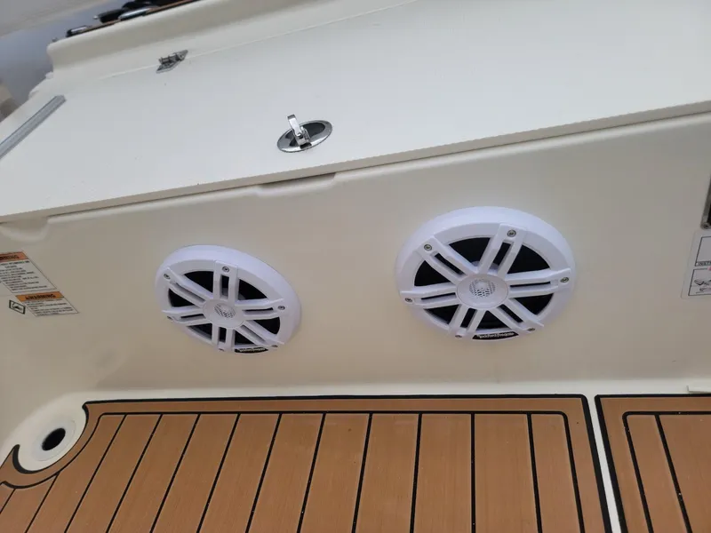 Slide: The Image of 2014 Zodiac Medline 580 boat with dual marine speakers and teak deck. - 16