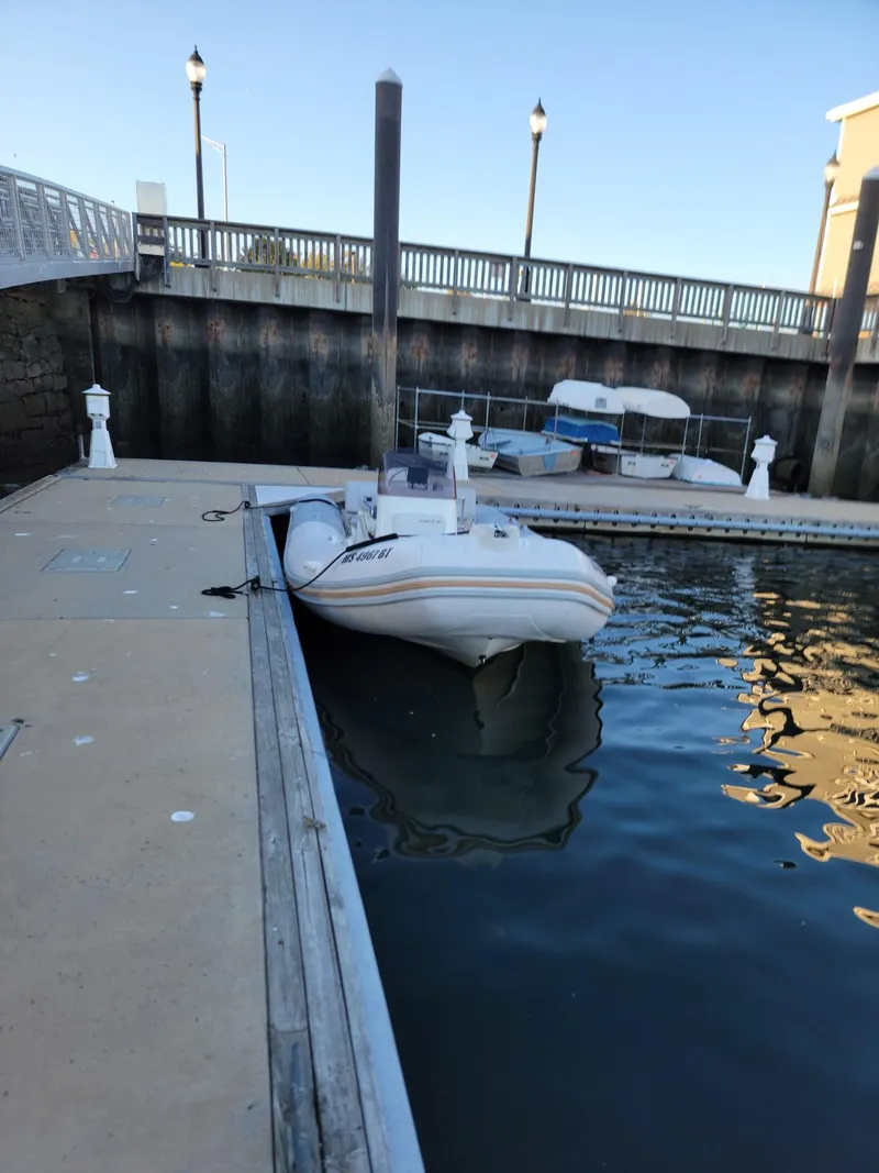 Slide: The Image of 2014 Zodiac Medline 580 docked at a marina. - 18