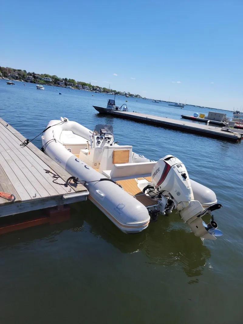 Slide: The Image of 2014 Zodiac Medline 580 inflatable boat docked on a sunny day. - 22