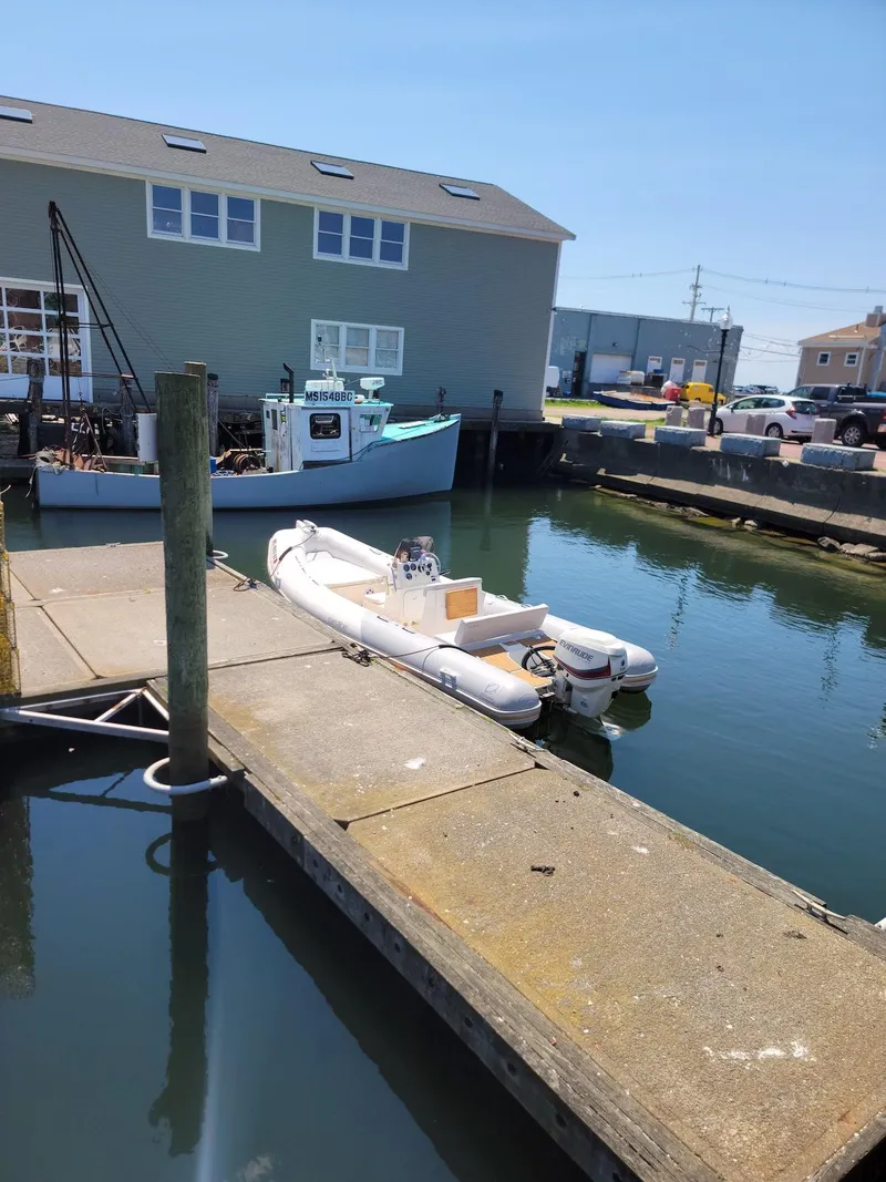 Slide: The Image of Zodiac Medline 580 inflatable boat docked in a marina, 2014 model. - 25