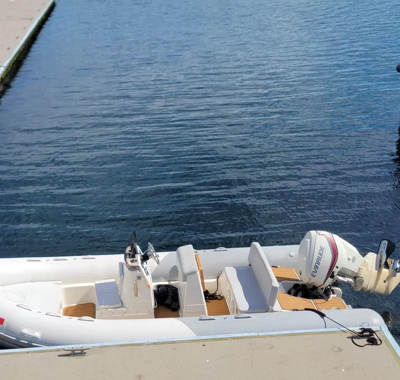 Slide: The Image of 2014 Zodiac Medline 580 boat docked on calm water. - 29