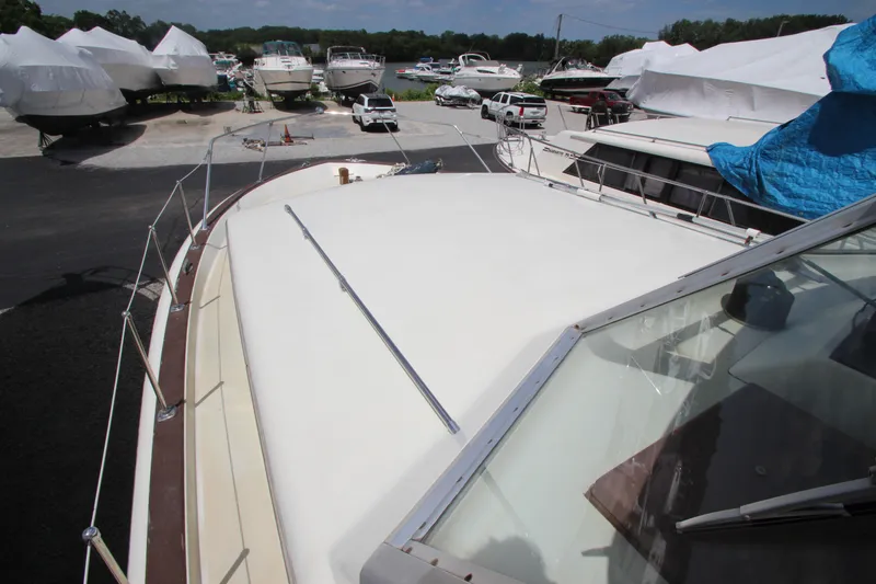 Slide: The Image of 1965 Chris-Craft Commander boat in a marina with other boats. - 10