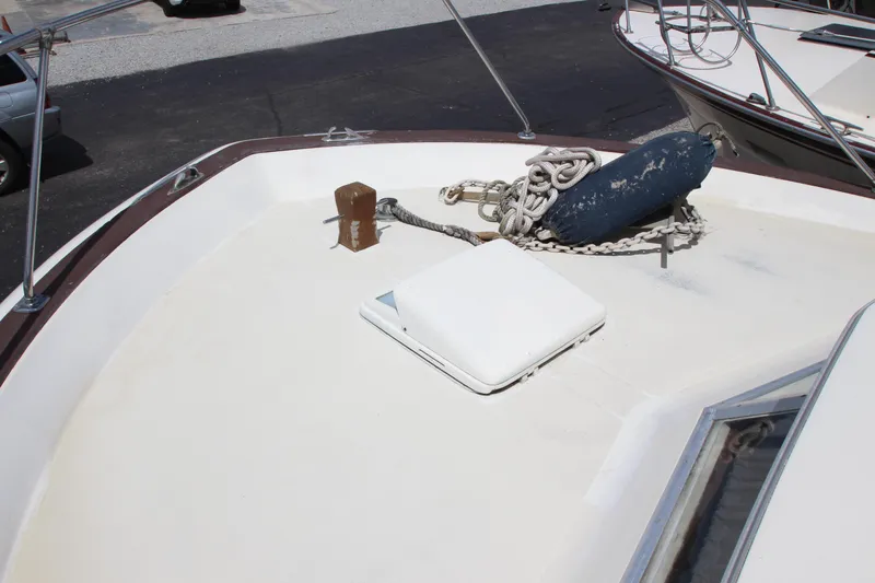Slide: The Image of 1965 Chris-Craft Commander boat deck with anchor and hatch. - 11