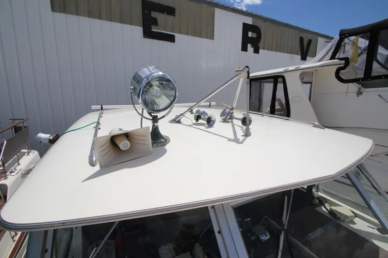 Slide: The Image of 1965 Chris-Craft Commander boat roof with spotlight and horn. - 14