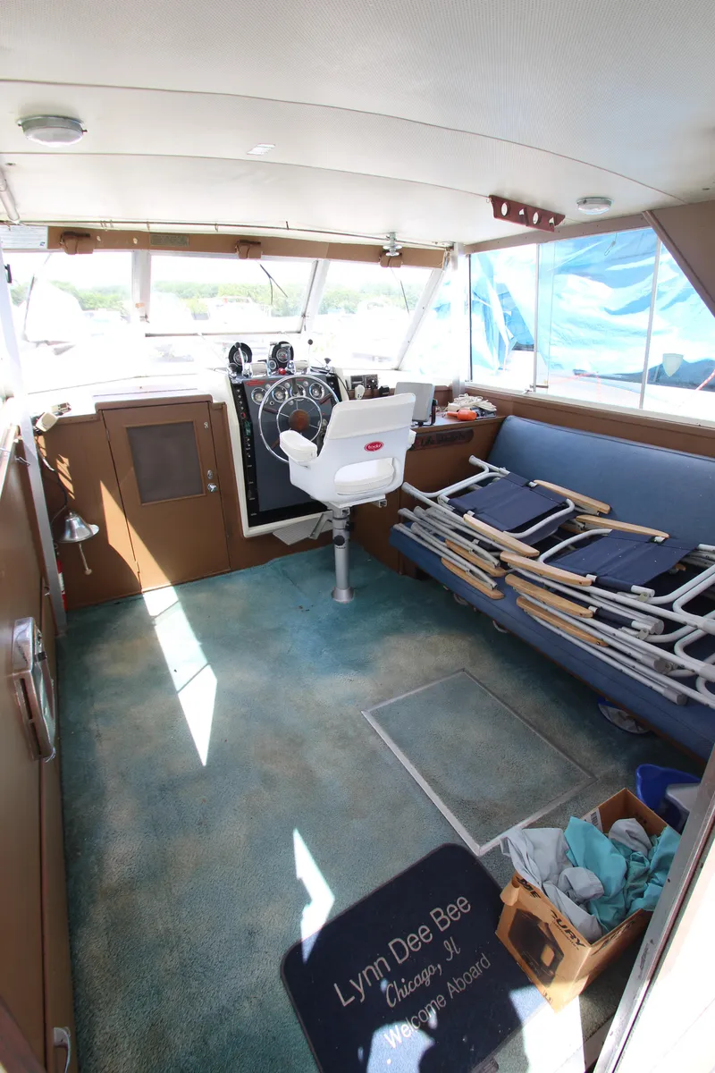 Slide: The Image of 1965 Chris-Craft Commander boat interior with helm station and seating area. - 17