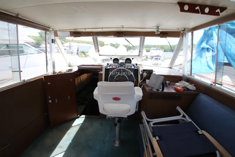 Slide: The Image of 1965 Chris-Craft Commander boat interior with captain's chair and control panel. - 19