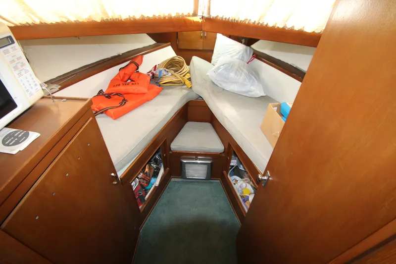 Slide: The Image of 1965 Chris-Craft Commander cabin interior with twin beds and storage. - 26