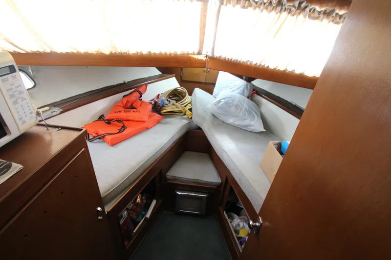 Slide: The Image of 1965 Chris-Craft Commander cabin interior with twin beds and storage. - 33
