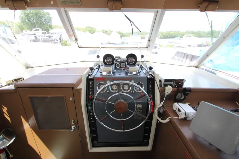 Slide: The Image of 1965 Chris-Craft Commander boat helm with vintage steering wheel and gauges. - 38