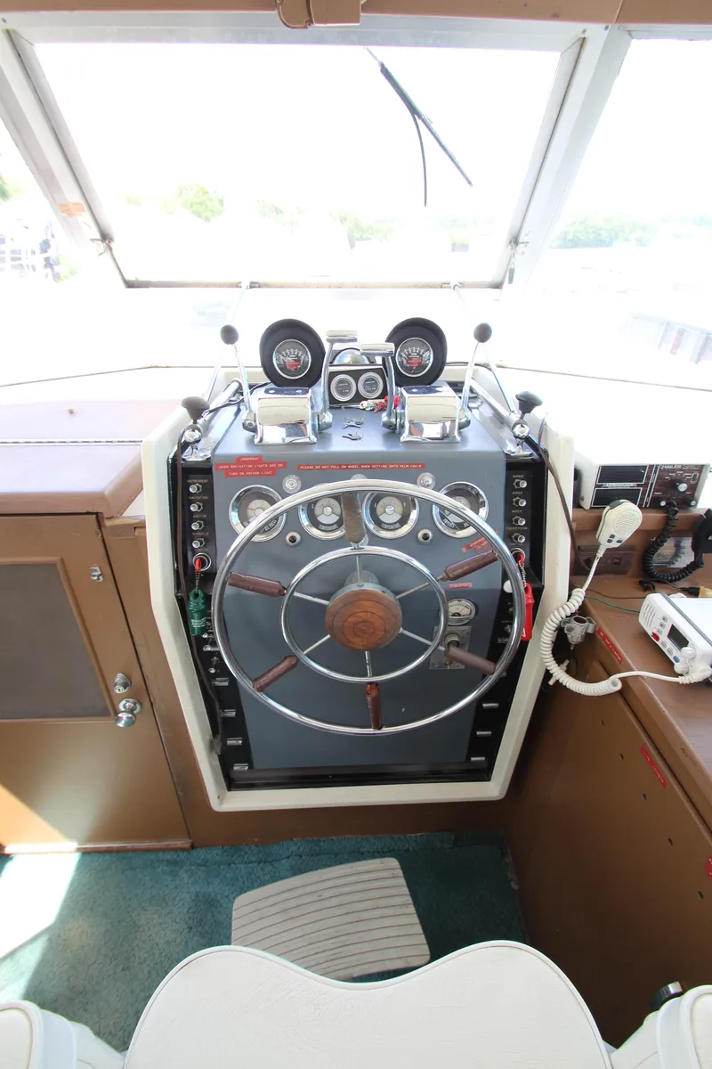 Slide: The Image of 1965 Chris-Craft Commander helm with vintage steering wheel and gauges. - 39