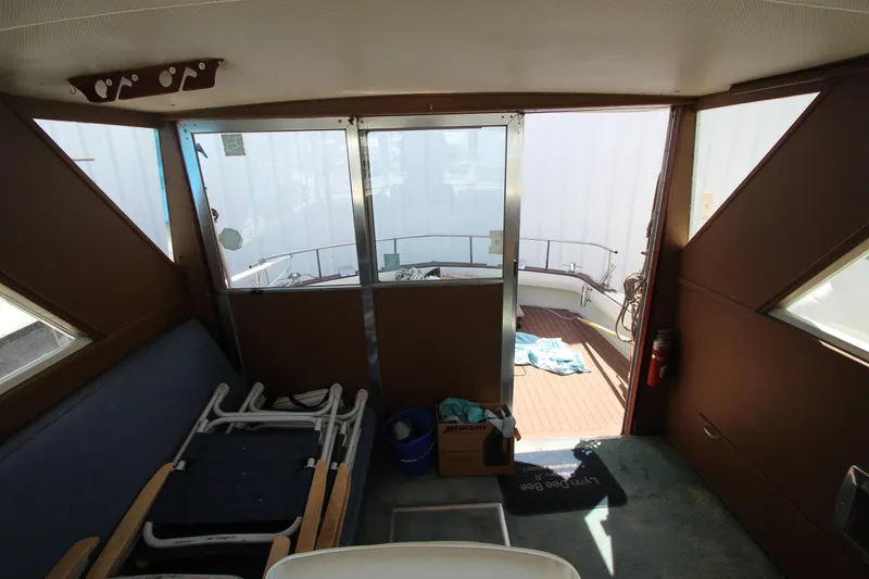 Slide: The Image of Interior of 1965 Chris-Craft Commander boat with deck view and seating area. - 40