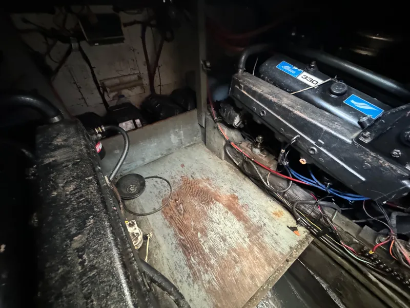 Slide: The Image of 1965 Chris-Craft Commander engine compartment with visible wiring and engine components. - 44