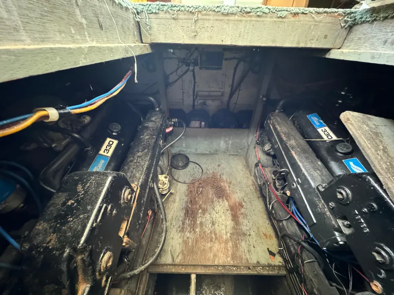 Slide: The Image of 1965 Chris-Craft Commander engine compartment with twin engines and wiring. - 45