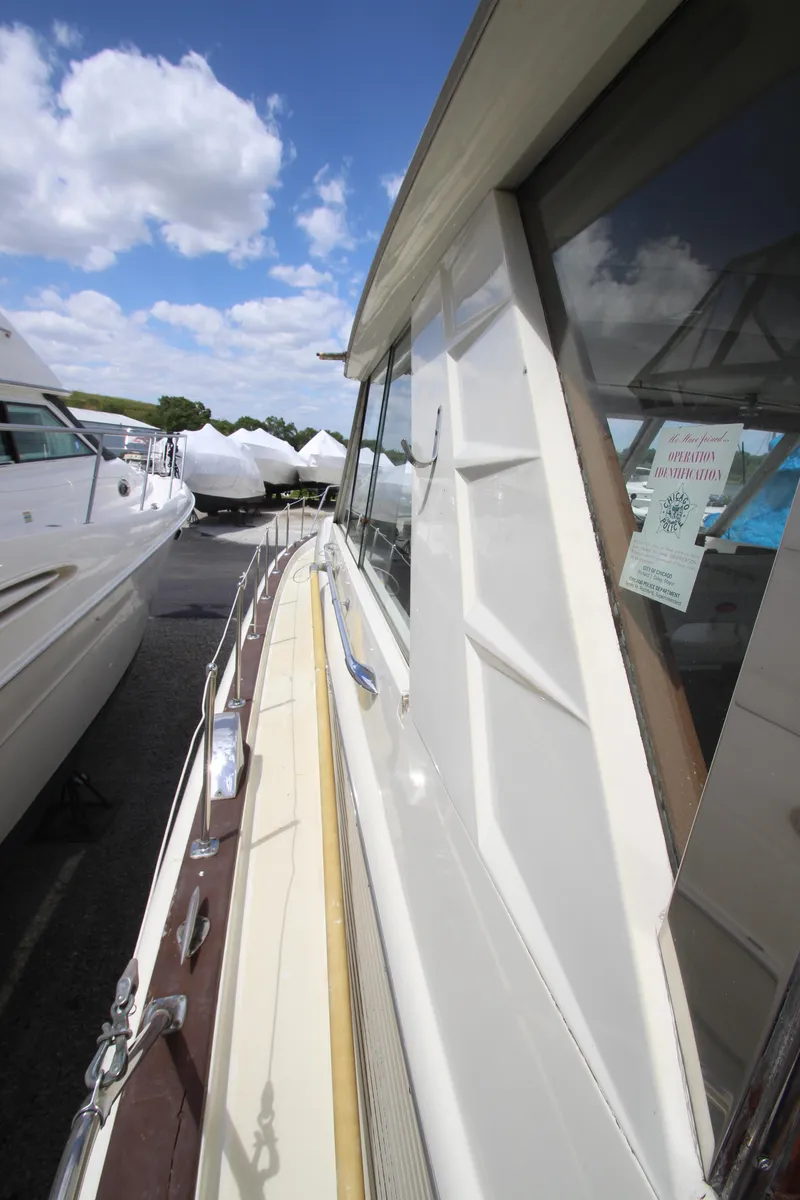 Slide: The Image of 1965 Chris-Craft Commander boat side view with clear skies. - 9