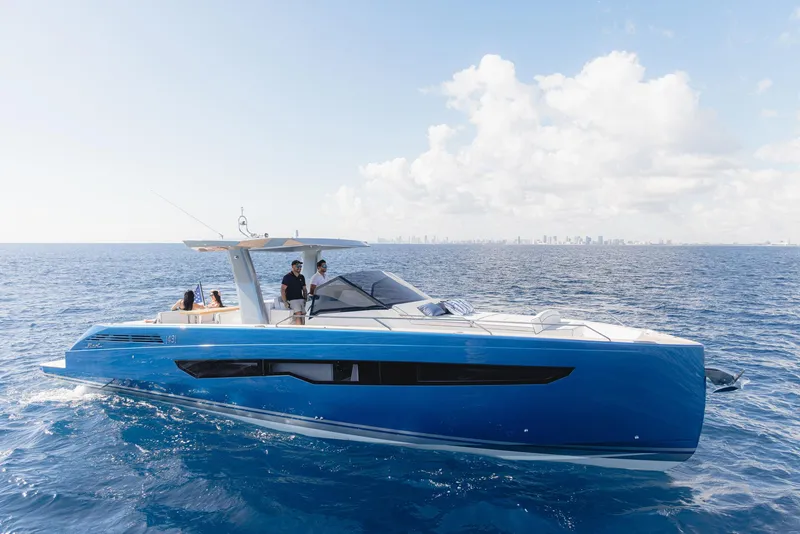 Slide: The Image of 2025 Fiart 43 Seawalker yacht cruising on open water with people on deck. - 3