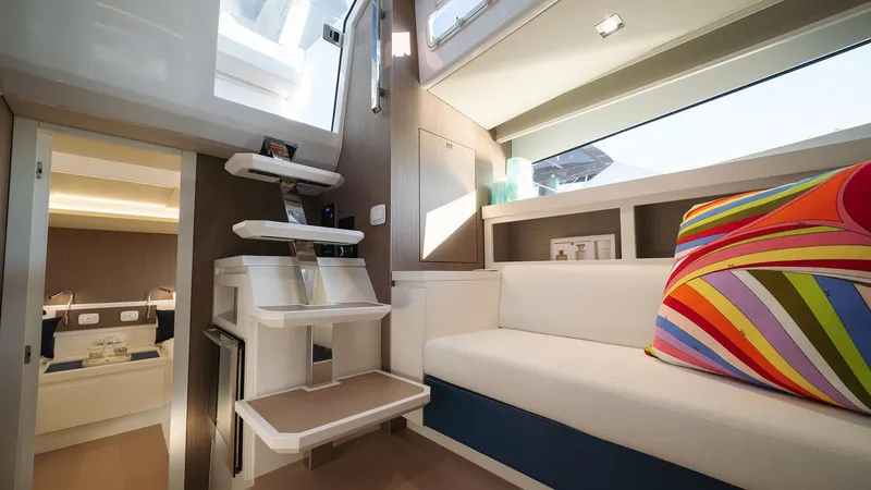 Slide: The Image of Interior of 2025 Fiart 43 Seawalker yacht with modern design and colorful pillow. - 5