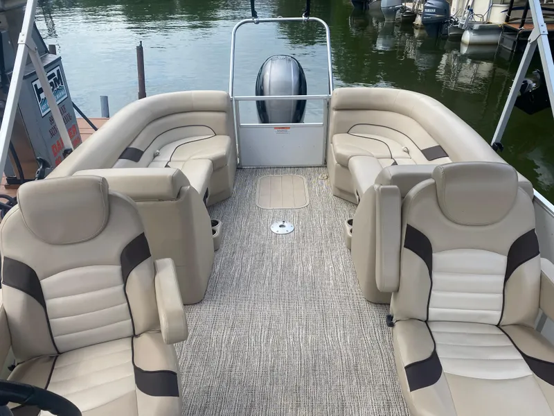 Slide: The Image of 2022 SunCatcher Select 322RC pontoon boat with beige seating and carpeted deck. - 2