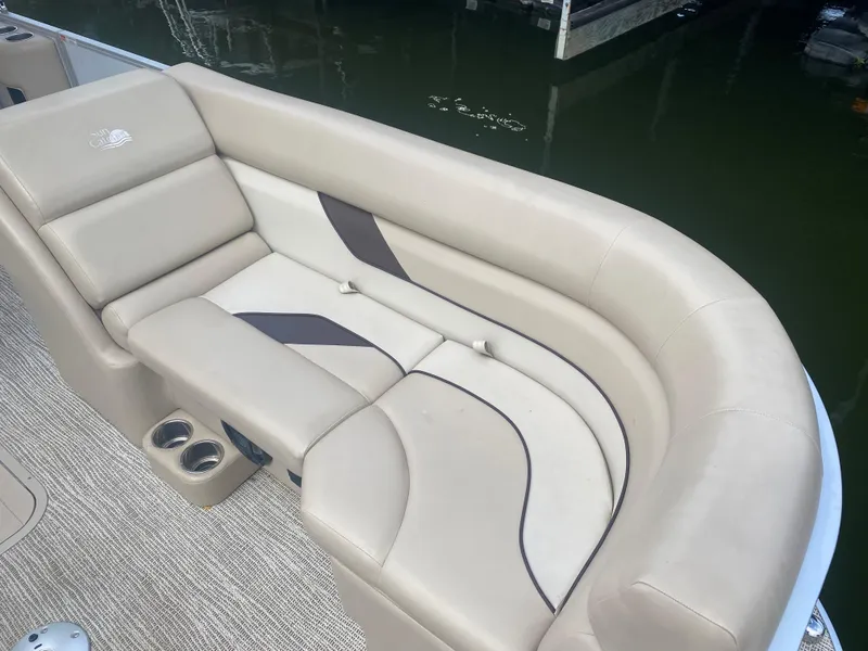 Slide: The Image of 2022 SunCatcher Select 322RC boat with beige and brown cushioned seating. - 3