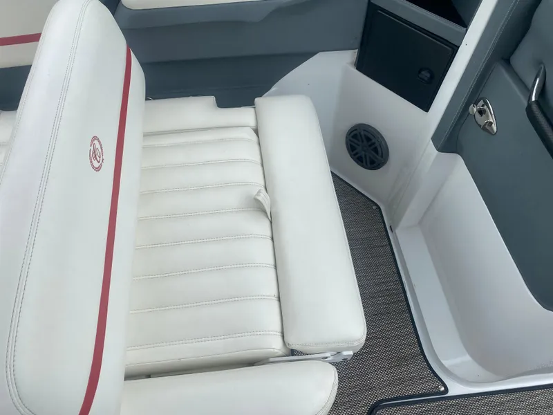 Slide: The Image of 2016 Cobalt R5 WSS boat interior with white leather seating and red accents. - 10