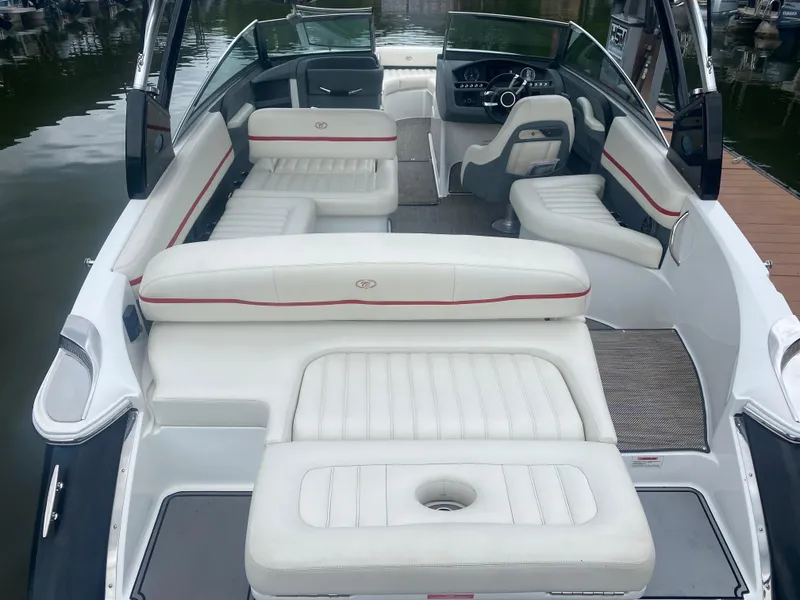 Slide: The Image of 2016 Cobalt R5 WSS boat interior with white leather seating and red accents. - 11